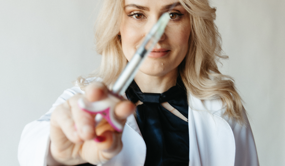 Doctor Natalya Borakowski holding a syringe photo