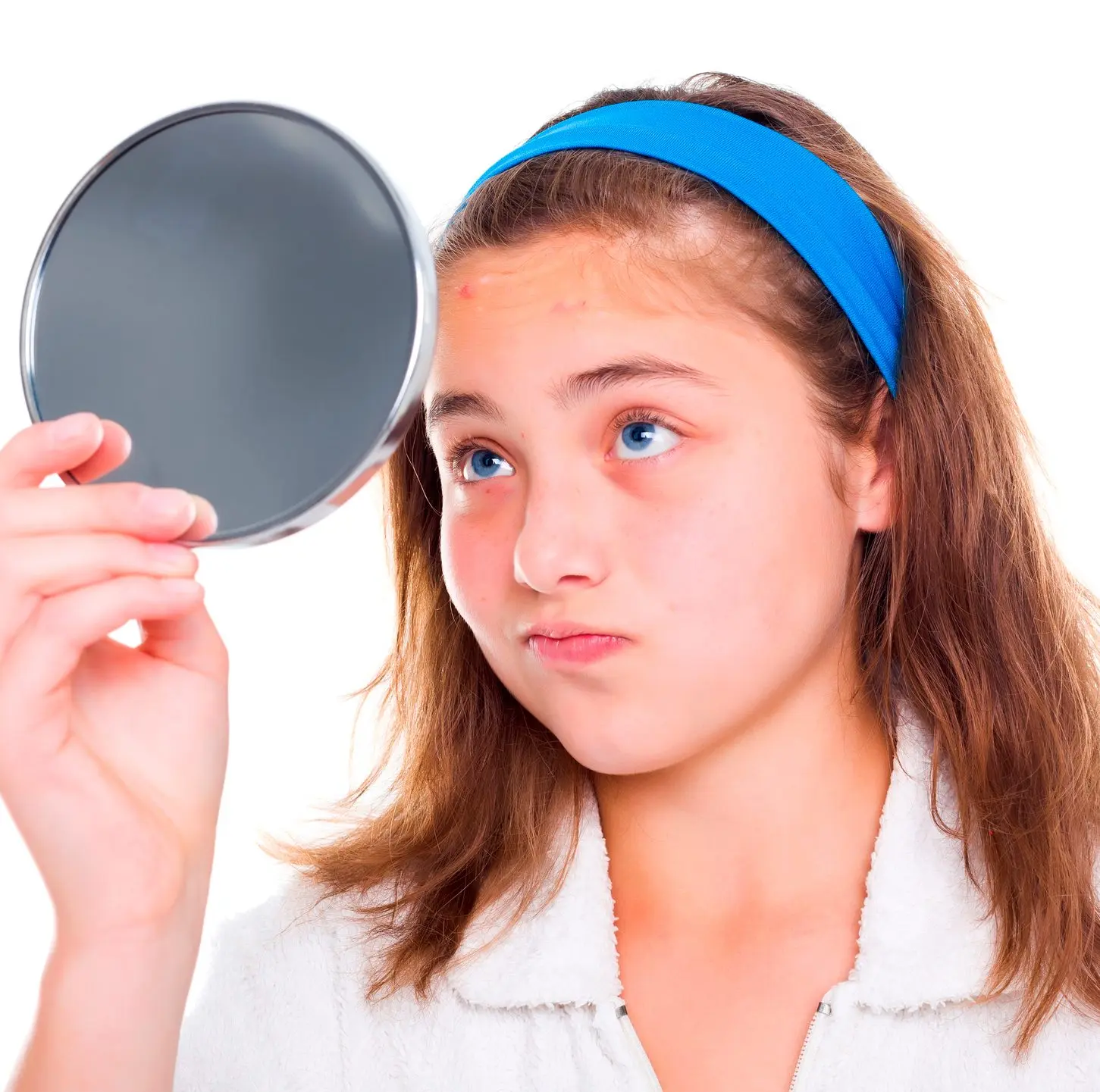 Girl receiving cosmetic pink facial mask