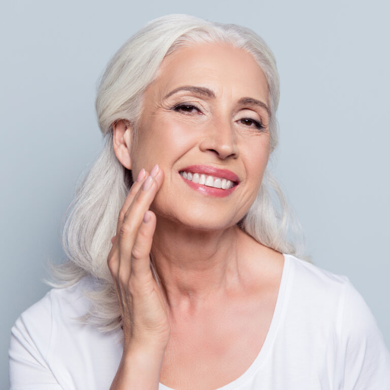 woman touching her face skin