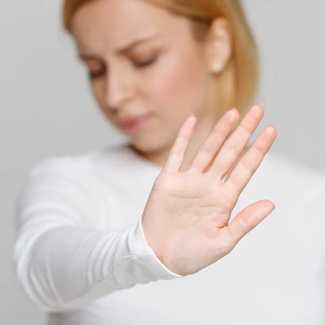 female palm hand showing stop sign