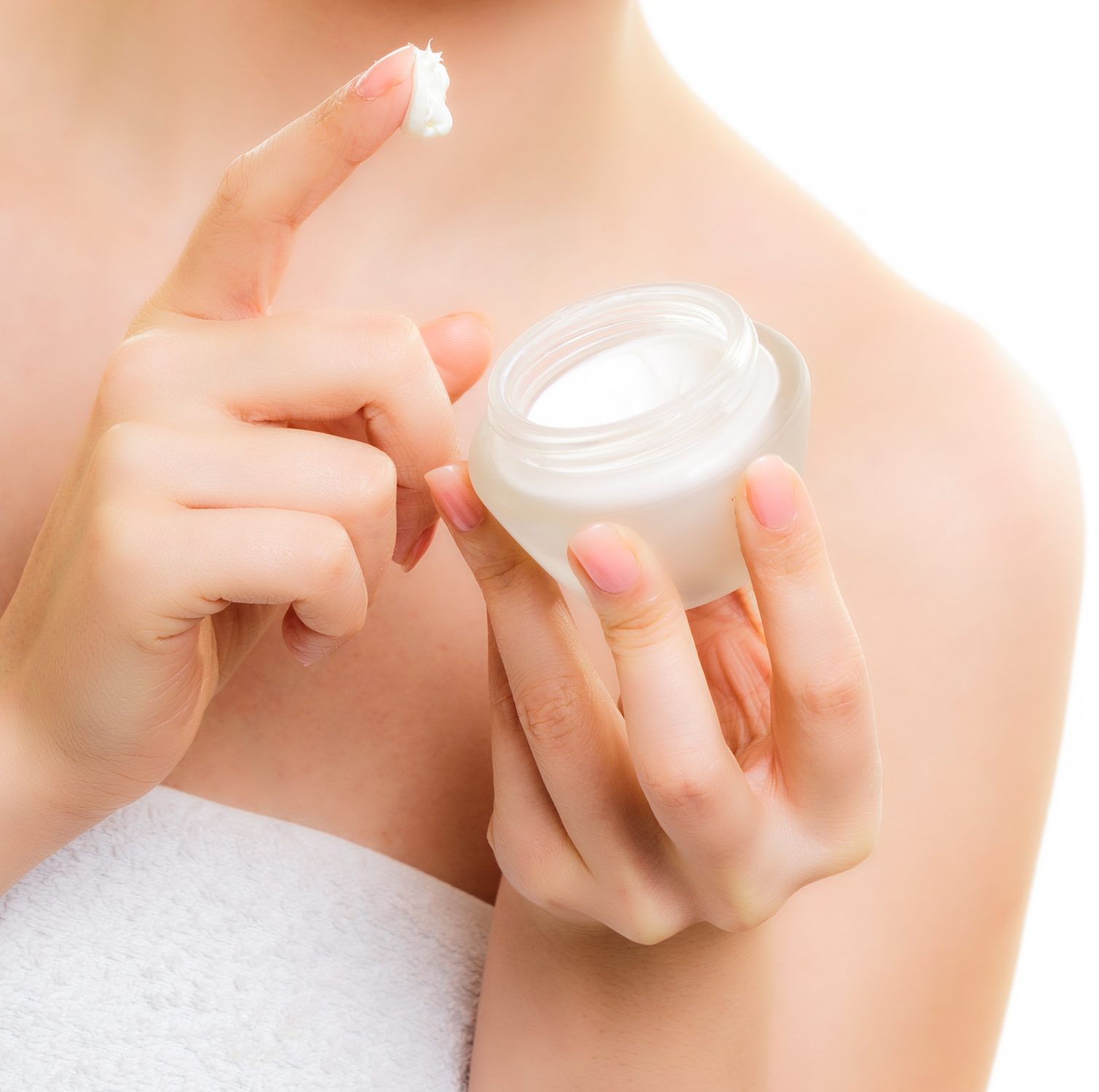 Skin care. Moisturizing cream in female hands