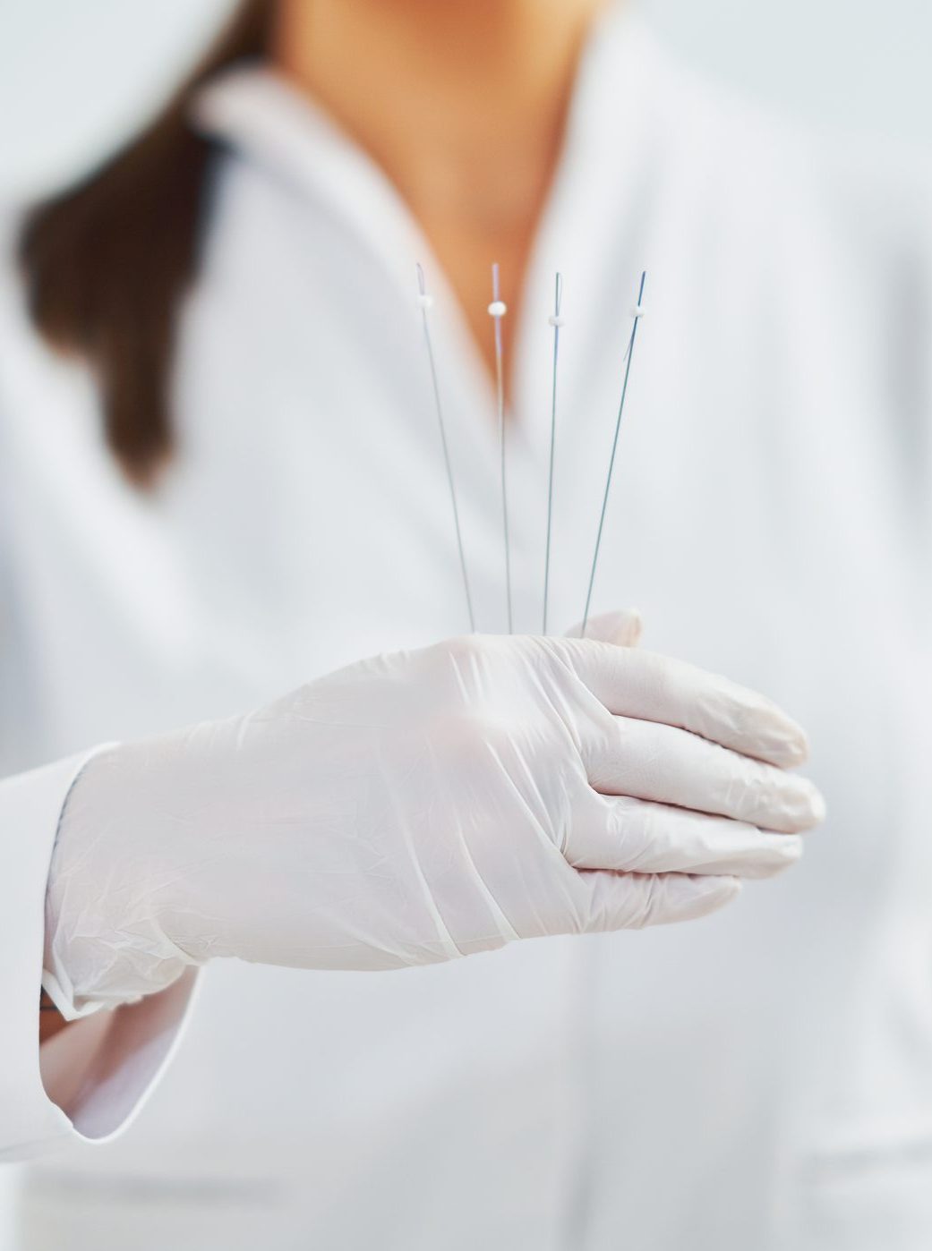 woman holding cosmetic threads