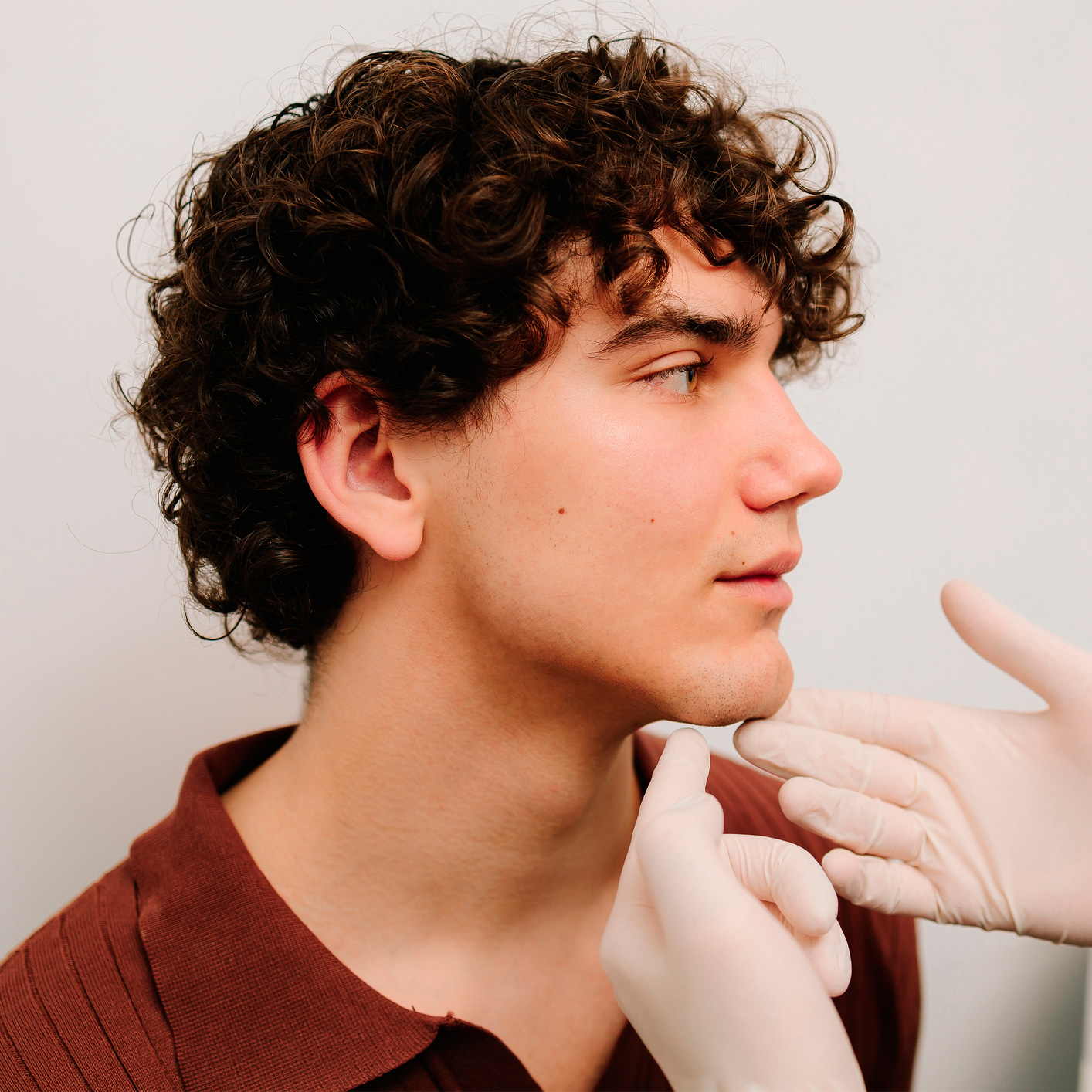 Chin and jawline reshaping to create a stronger, more angular masculine profile