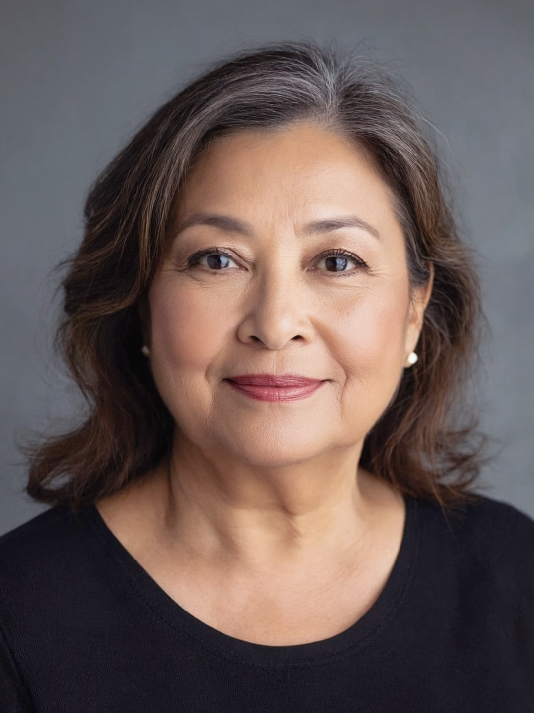 Portrait of a 45-50 year old woman with a full, round face and a calm, approachable expression, representing the target audience for Ozempic Face information