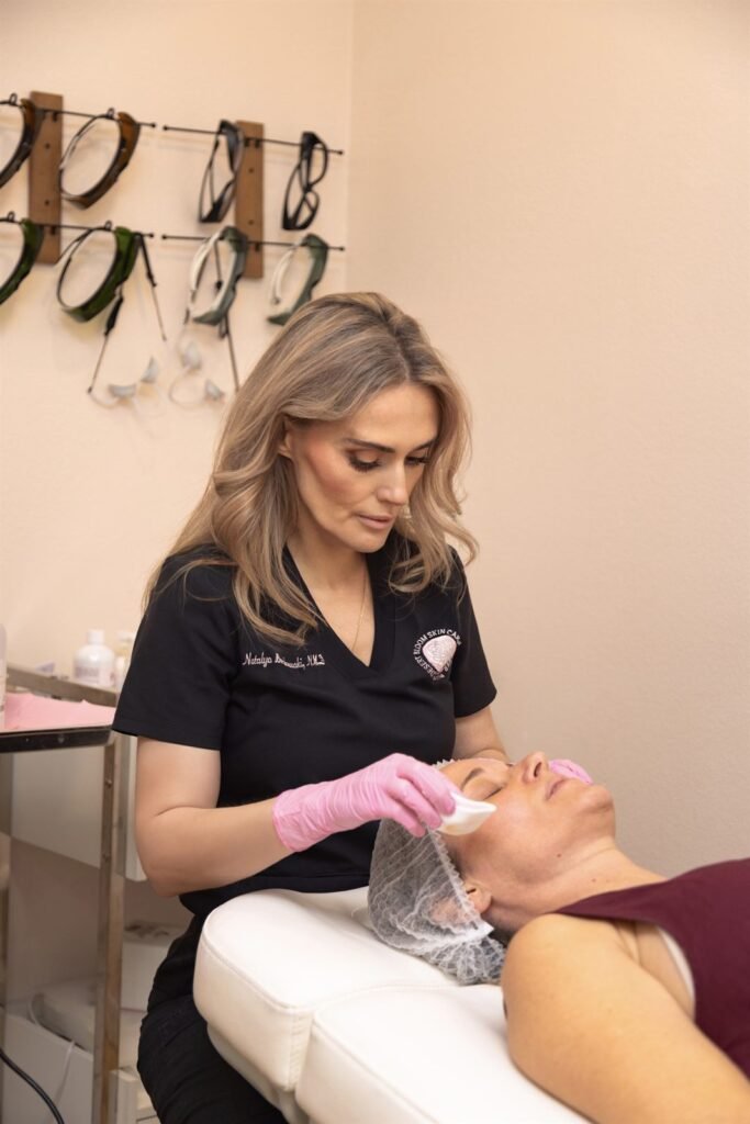 Dr. Natalya Borakowski, NMD, preparing a patient's skin for a laser treatment